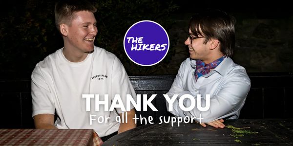 Two men smiling and conversing with a thank you message for support.