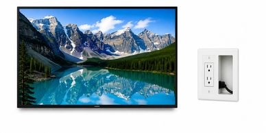 TV with mountain scene and wall power outlet.