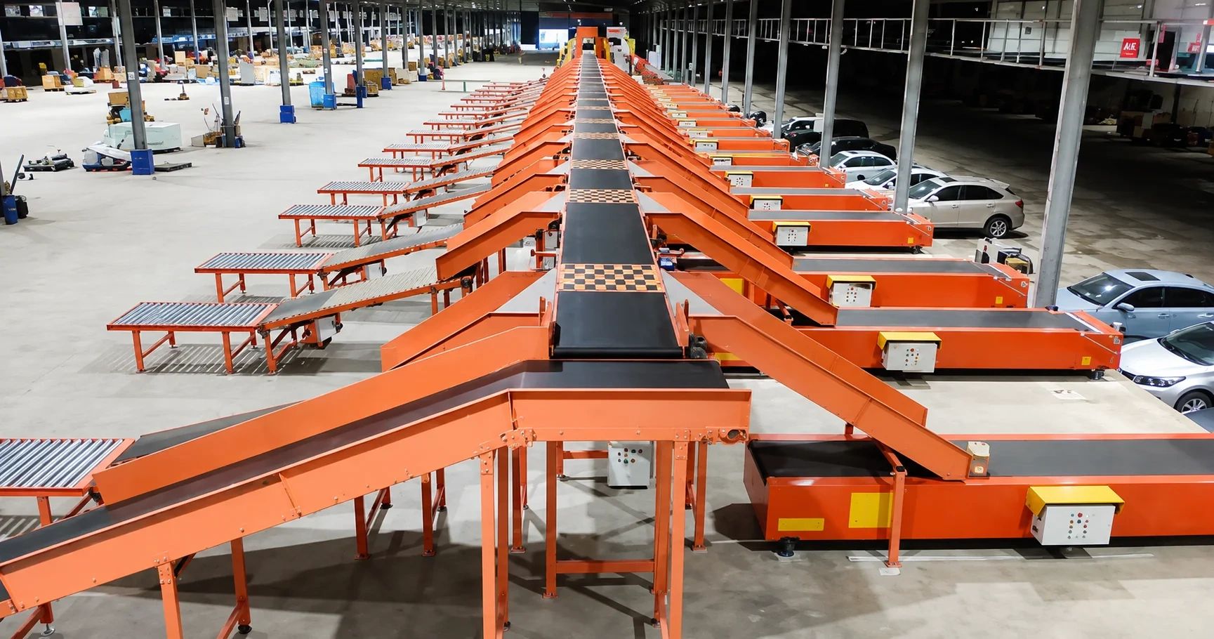 NetRay automated parcel sorting conveyor system with multiple sorting lanes for high-speed warehouse