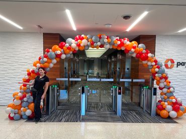 Large 10 ft. high balloon arch, perfect for decorating entrances in high-ceiling venues for corporat