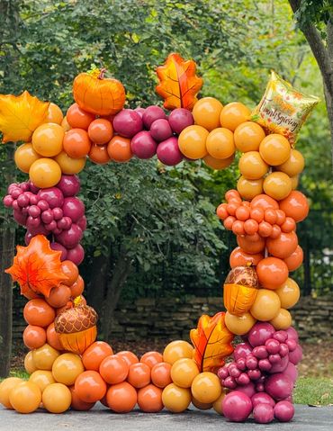 Autumn-themed balloon frame with acorns, leaves, and pumpkins.