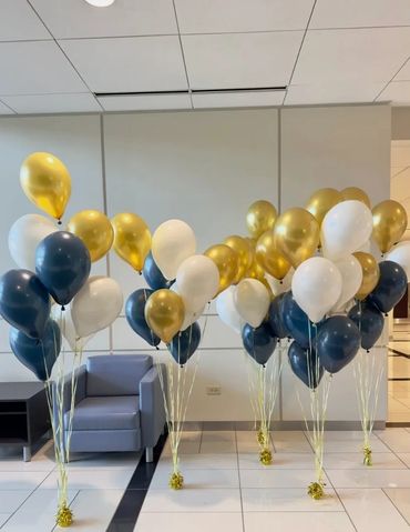 Floor-standing helium balloon bouquets in custom colors for a corporate event.
