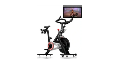 Modern exercise bike with screen for interactive workouts.