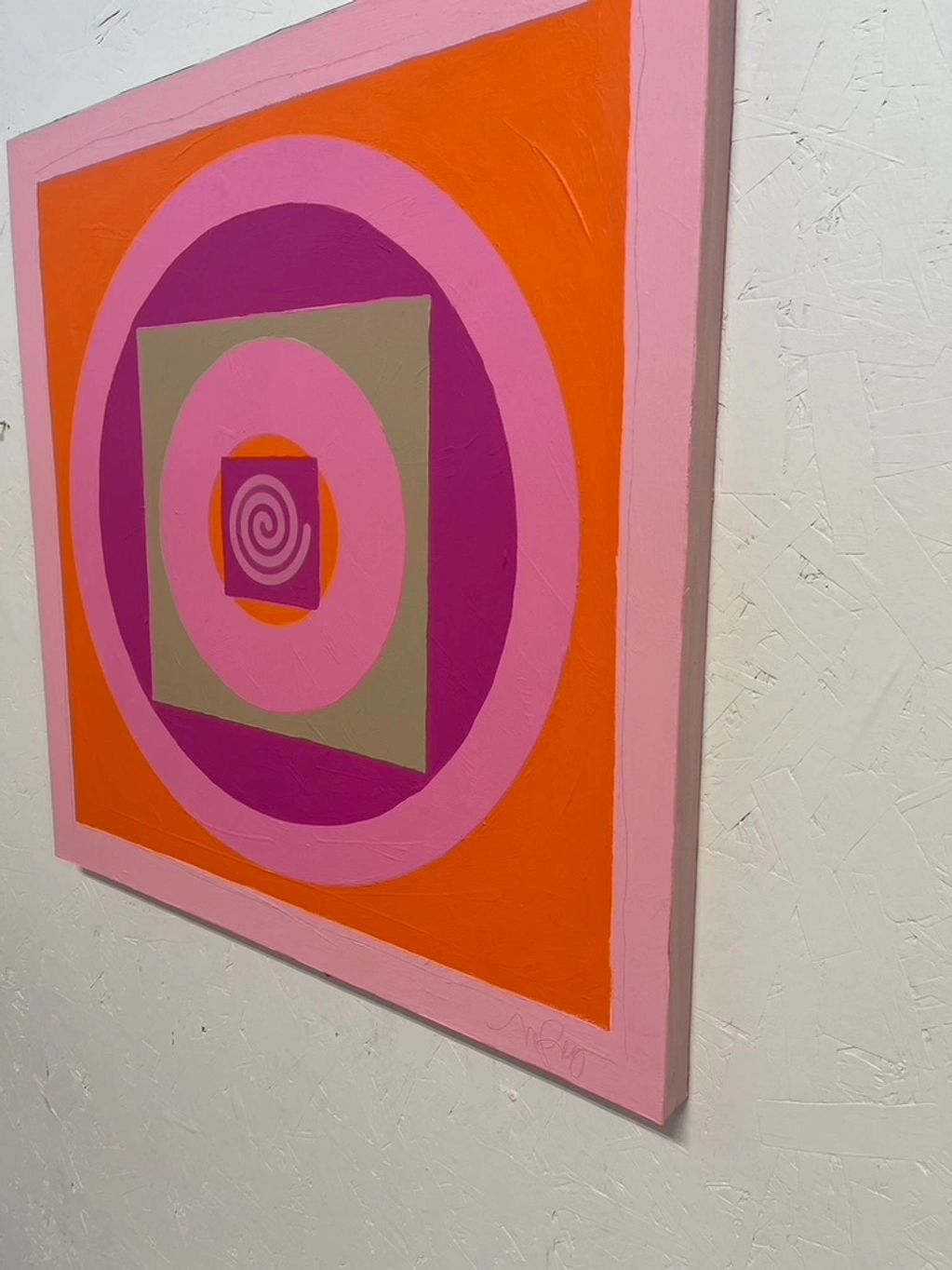 Abstract painting with concentric circles and squares in vibrant pink, orange, and purple hues.