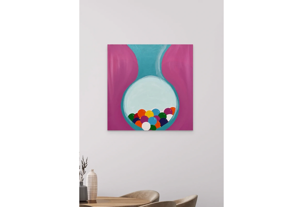 Abstract painting with colorful balls inside a turquoise and pink shape on a white wall.