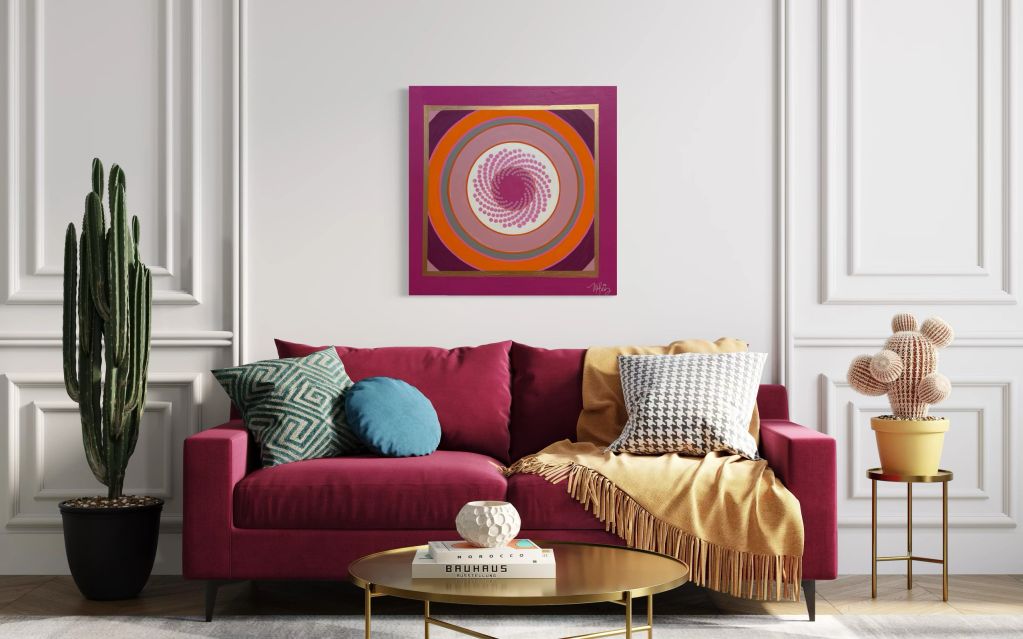 Modern living room with a magenta couch and vibrant wall art.
