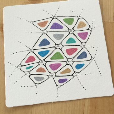 Abstract geometric art with colorful shapes connected by black lines on textured paper.