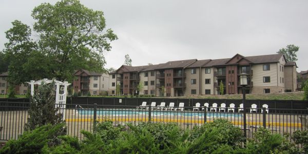 View of 3600 new construction with pool and sundeck in the foreground.  Lovely apartment living. 