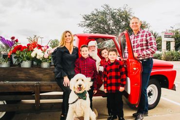 Client application event with Santa and beautiful flower bouquets.  Frisco, TX