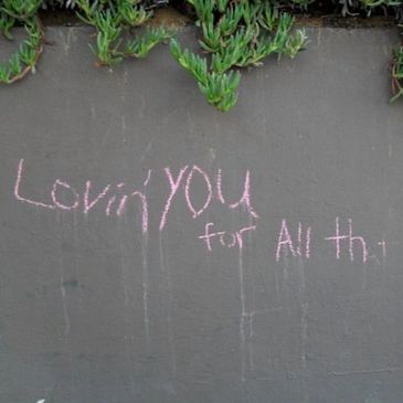 Chalk message on a wall saying 'Lovin' YOU for all that you do!'