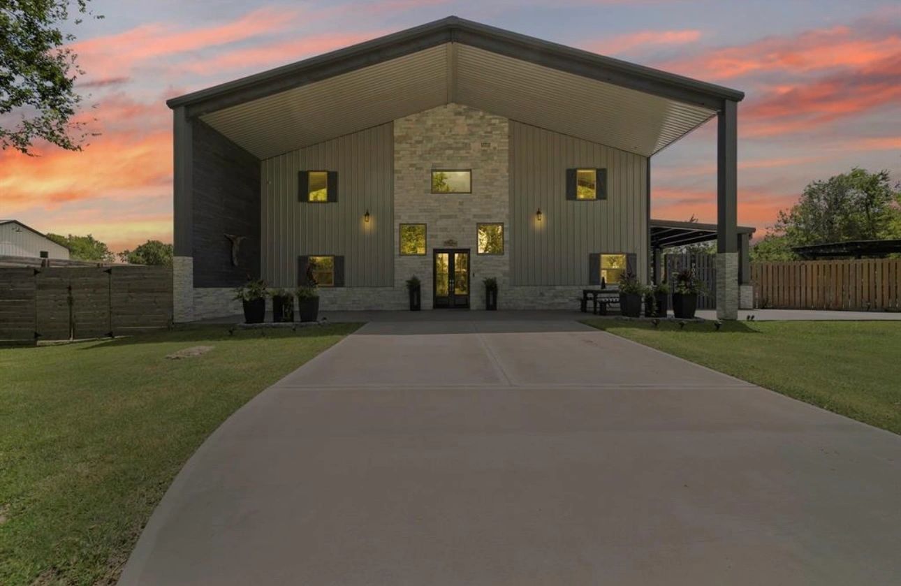 This modern two‑story home showcases bold architectural lines and highlights the clean curb appeal.