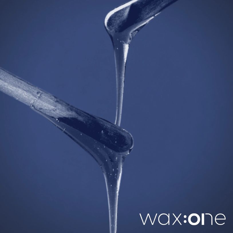 Close-up of sticky wax dripping from sticks.