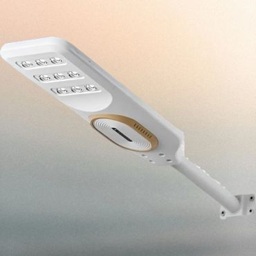 Modern white LED street light with solar panel and motion sensor.