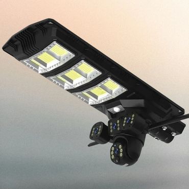 A black outdoor solar LED light with dual security cameras.