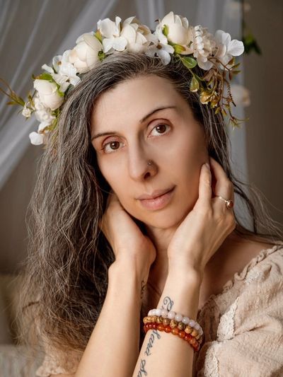 Lady with crown of flowers around her head.