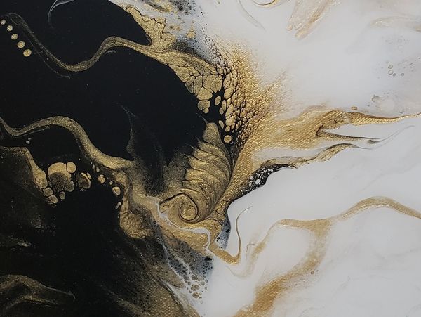 Elegant black, white, and gold abstract fluid art with swirling patterns.