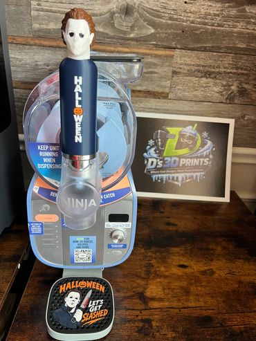 Halloween-themed beer tap with Michael Myers handle and "Let's Get Slashed" drip tray.