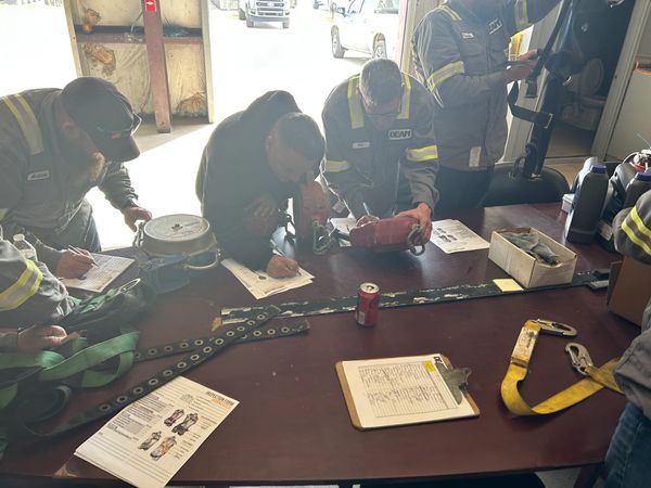 Worker signing industrial safety document
