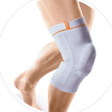 Knee bandage with added medial/lateral silicone bobble adhesive strip.