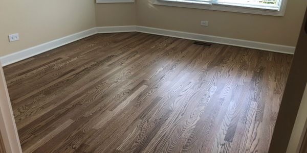 Complete sand and stained oak floors with Aged Barrel stain. Water-based finish