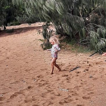 child on beach, on family holiday