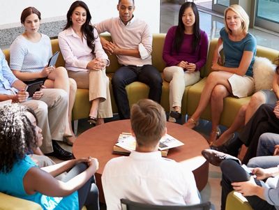 group of people sitting around a table