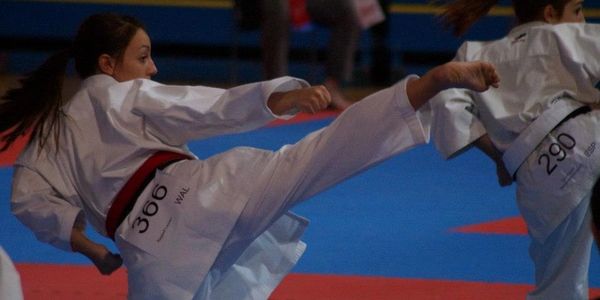 Sensei Lauren Raggett competing with mawashi geri