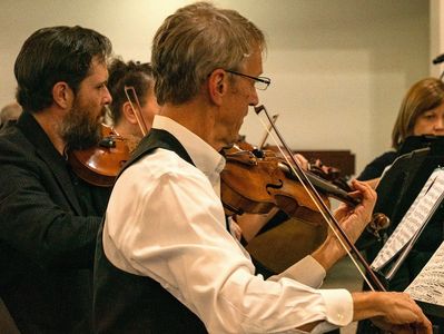 String ensemble at an event with Joe Jewett and Conor Jacobson playing violin