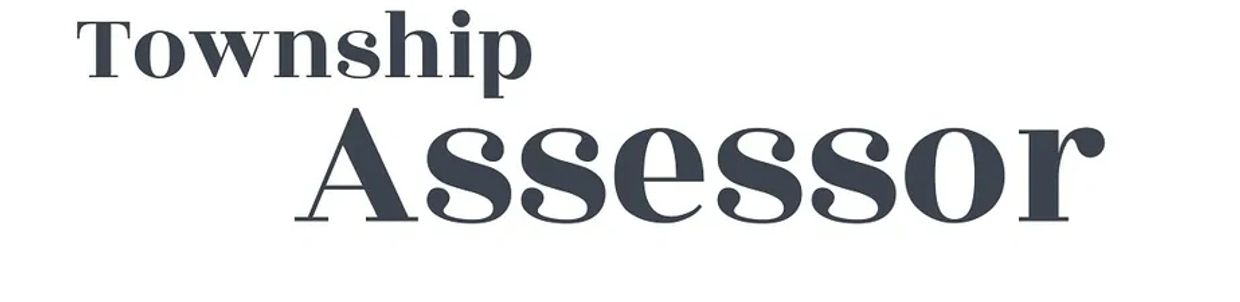 Sign reading 'Township Assessor' in bold and clear font.