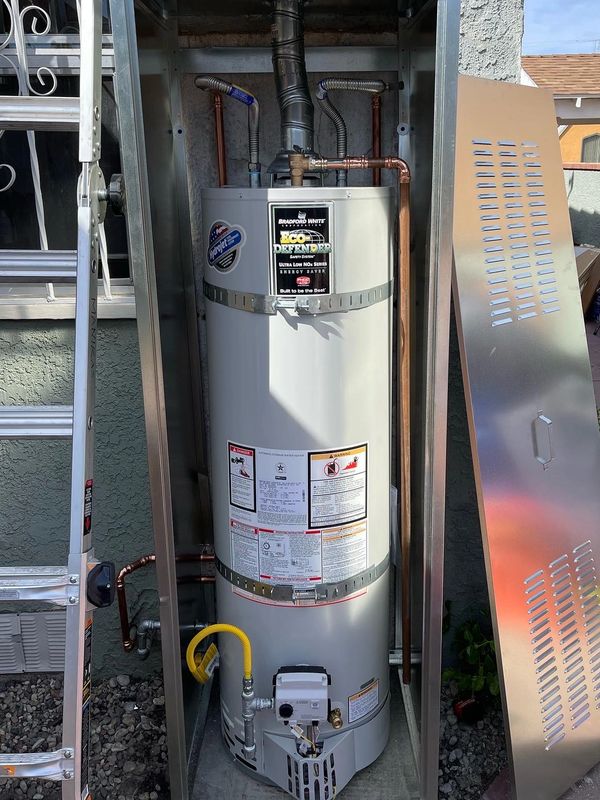 Water heater outside in metal shed