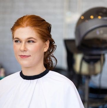 lady-Theresa holt with wet saffron hair undergoing a steam treatment for scalp problems and scaling