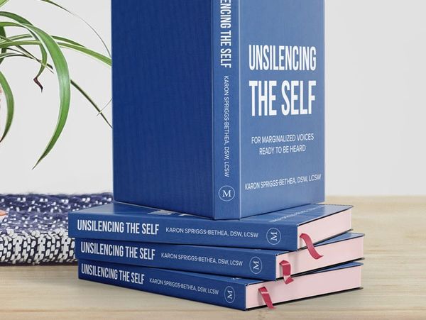 Blue book cover with the words: Unsilencing the Self: For Marginalized Voices Ready to be Heard