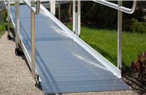 Aluminum wheelchair accessible ramp, allowing for rolling items to go up and down into home 