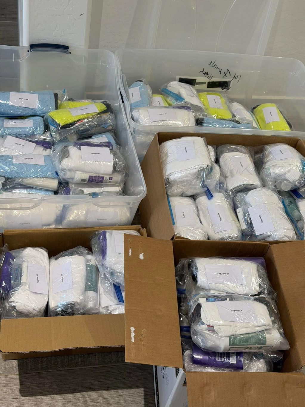 Boxes filled with hygiene kits packed in plastic bags.