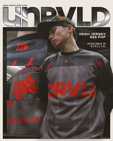 Model wearing unrvld mesh jersey in dark gray and red.