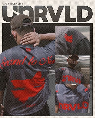 Man wearing a grey shirt with red text and design.