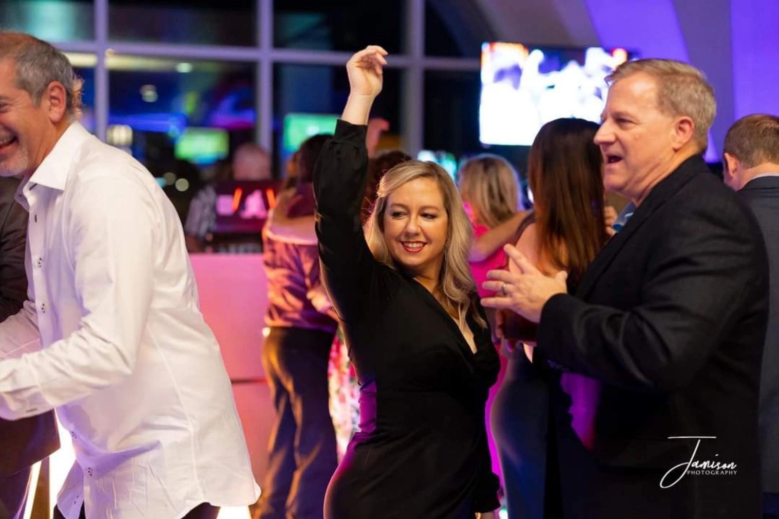 People dancing and enjoying at a lively party.