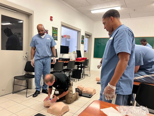Certified trainer leading an American Red Cross CPR course.