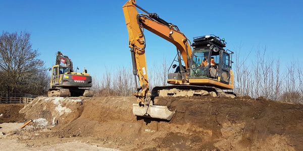Excavator pulling dirt