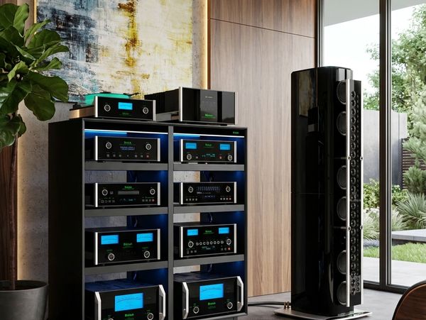 High-end audio system with multiple components and large speaker.