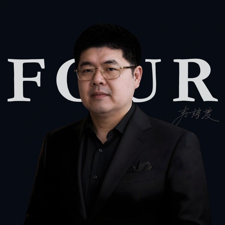 Portrait of a man in a black suit with glasses against a dark background. Thoughtful, reflective, in control, grief