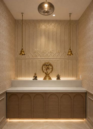 Decorative religious altar with statues and hanging bells.
