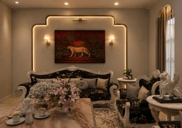 Elegant living room with dark floral sofas and warm lighting.