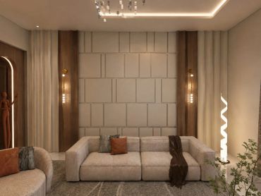 Modern living room with beige sofa and warm lighting.