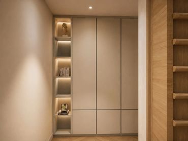 Modern beige cabinet with built-in shelves and soft lighting.