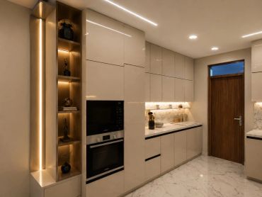 Modern kitchen with warm lighting and beige cabinetry.