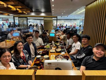 Group of friends enjoying a meal in a restaurant.