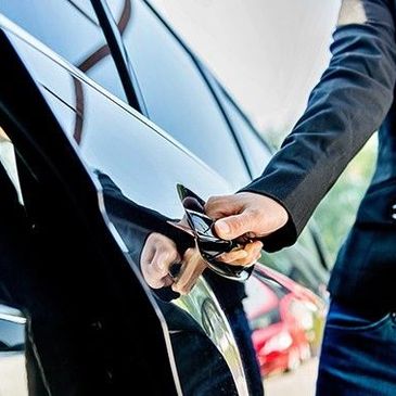 Close up shot of a man opening the door of a car