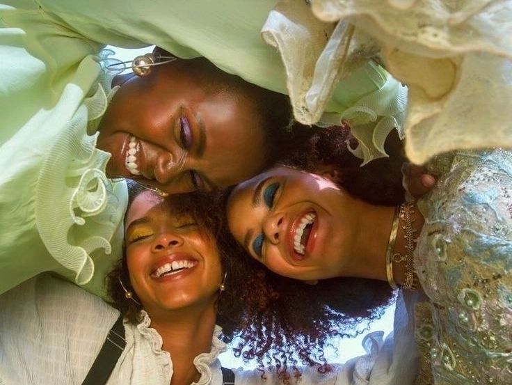 3 happy young women.