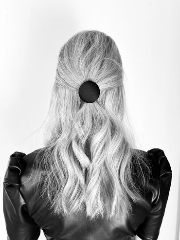 Unique hair Bobbin with a button attached to it